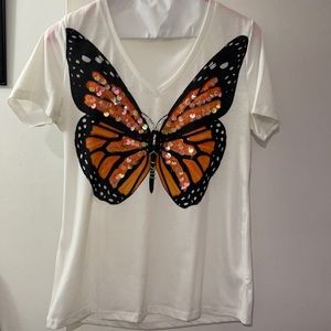 White top with a butterfly